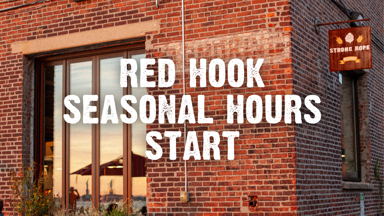 Red Hook Seasonal Hours Start with exterior of taproom with brick wall and sunset reflecting off windows