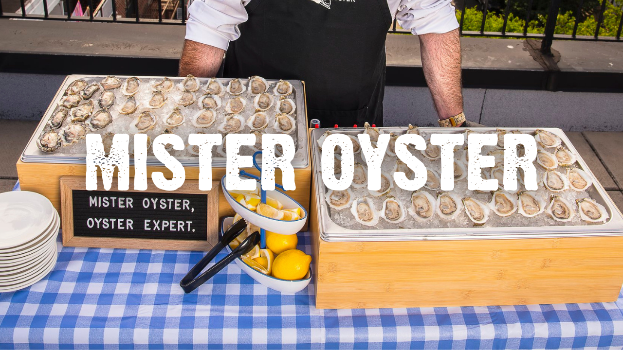 Mister Oyster with a table of oysters on ice