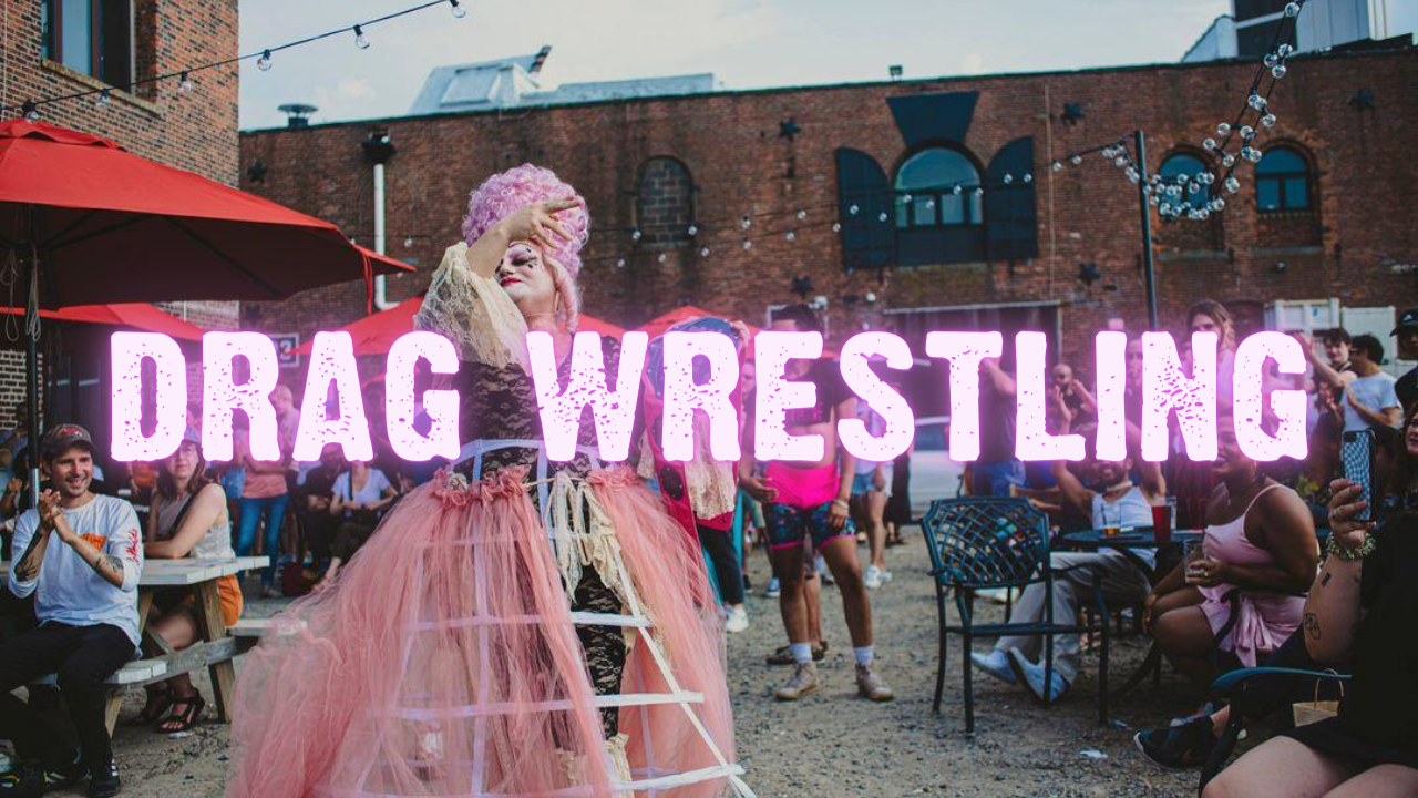 Drag Wrestling — a performer in drag with 18th-century style walks down a walkway outside with people cheering nearby