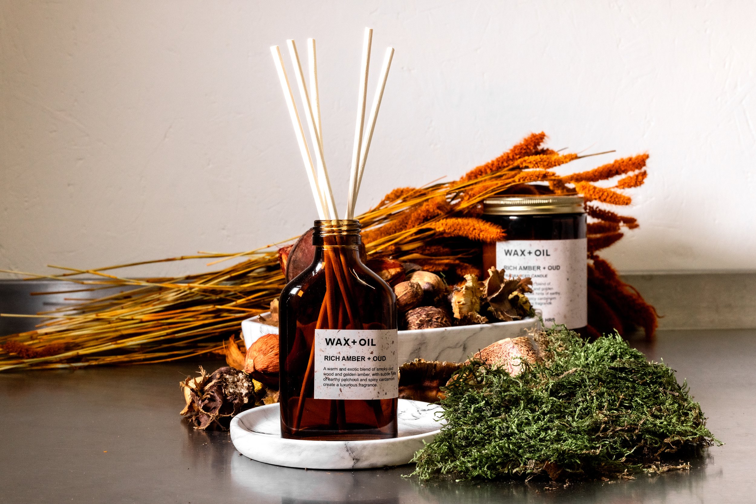 Aromatic diffuser and candle with reeds, nature-inspired decor
