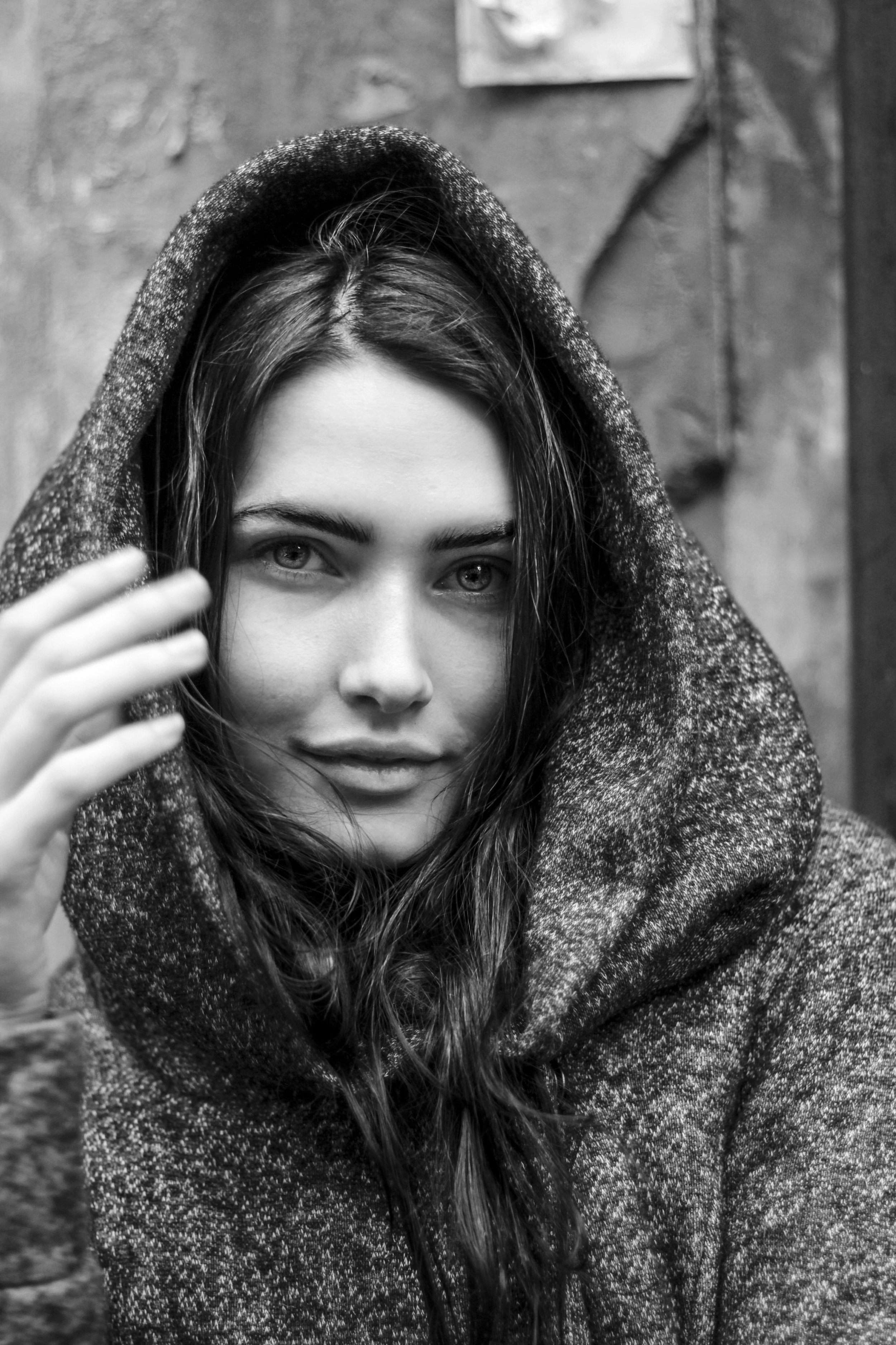 Black and white portrait of a woman with a hooded sweater