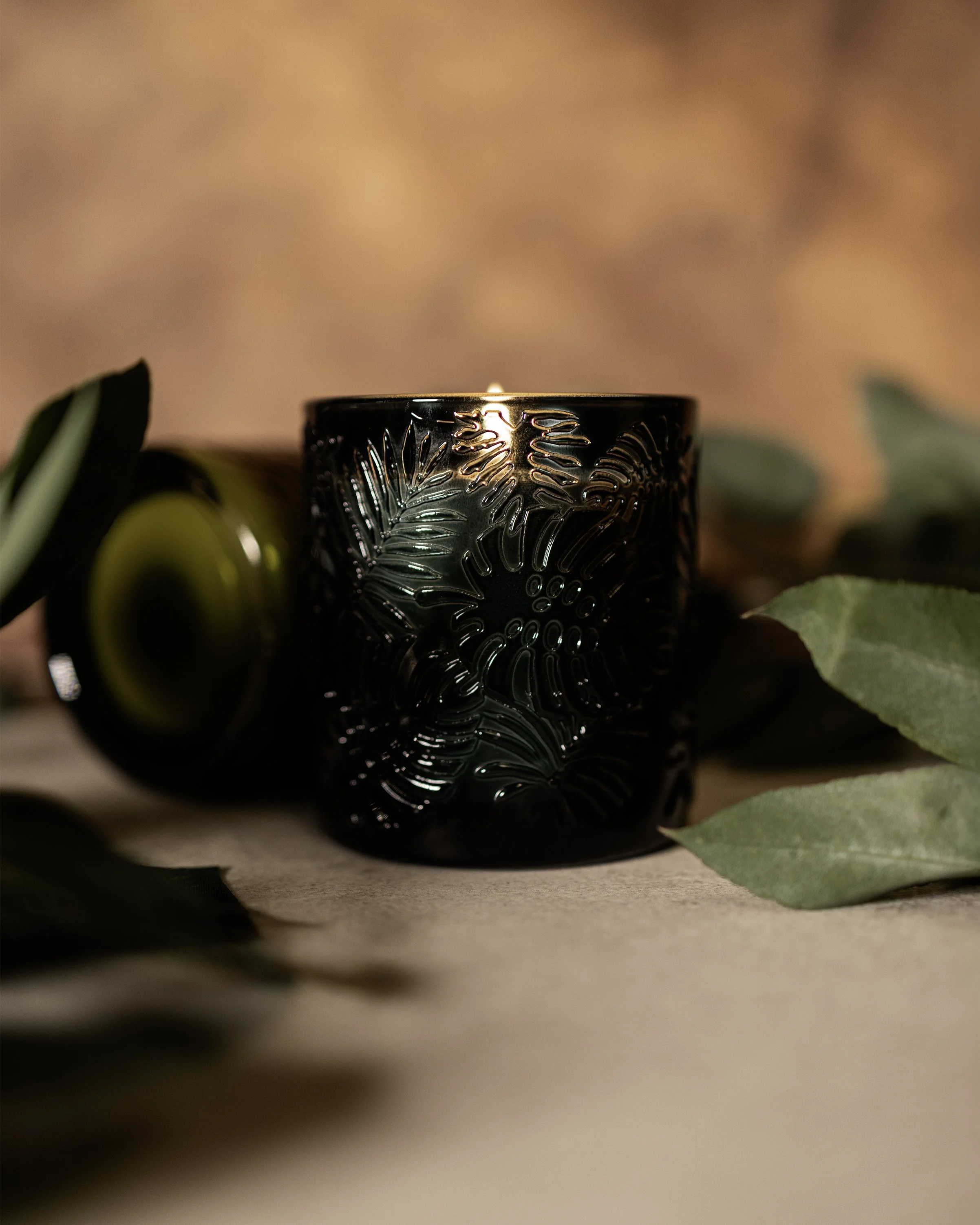 green candle with textured pattern.jpg