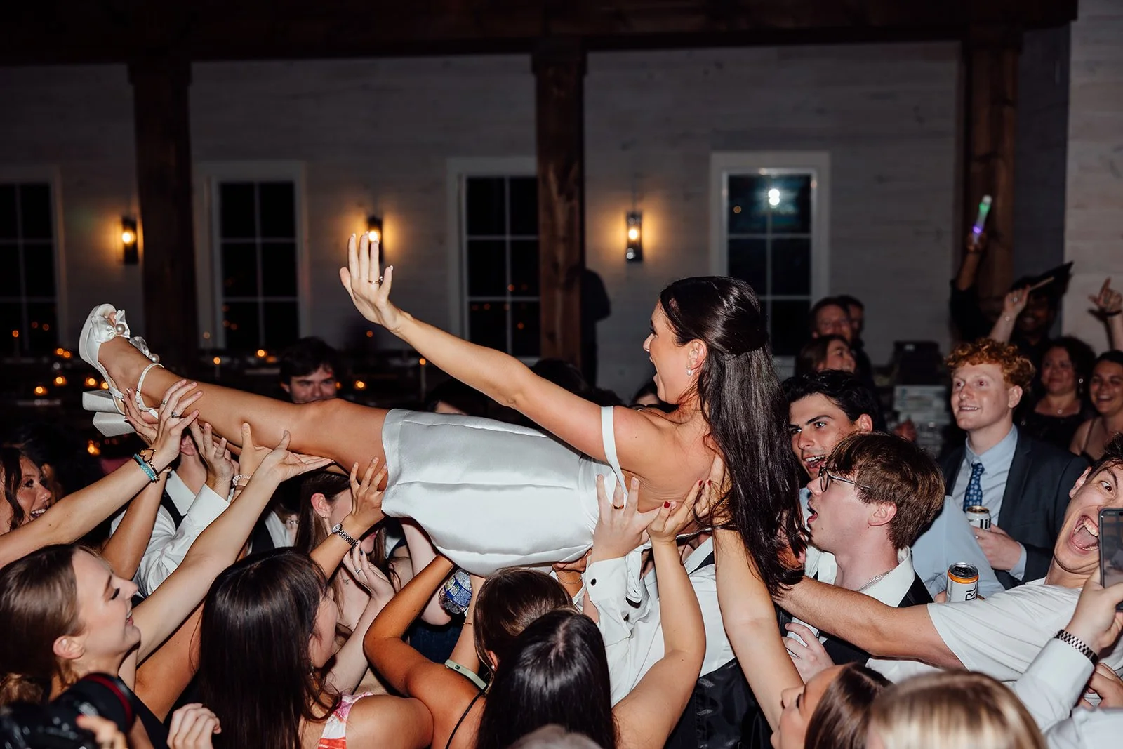 If your dream night includes crowd surfing with all your favorite people&hellip; we&rsquo;re 100% here for it. 🎶

📸: sincerelylindsayphotography

#NashvilleWeddings #WeddingDJ #MusicCityEvents #UnforgettableMoments #WeddingVibes #BrideAndGroom #Par