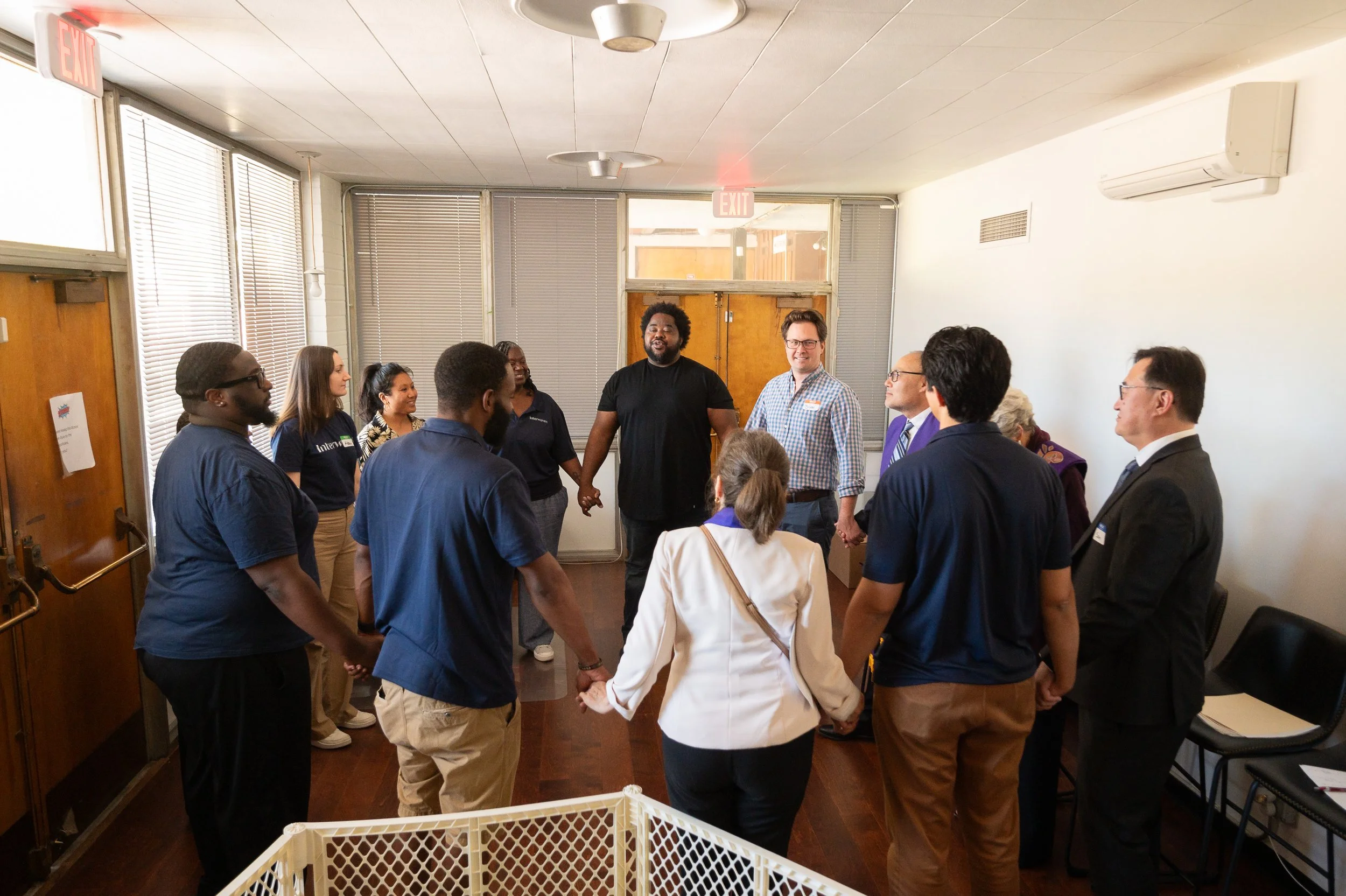 Geometric drawing of an outline square with sections divided by vertical, horizontal, and half circle lines.