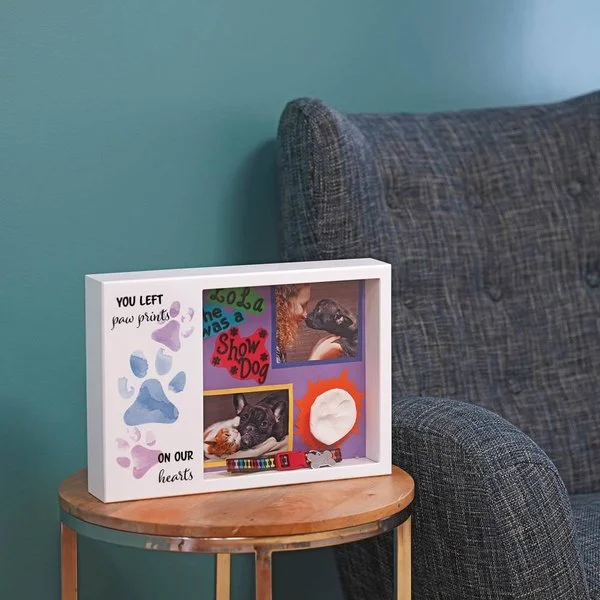 shadow box urn for pets with memento area and 'You Left Paw Prints On Our Hearts' inscription.