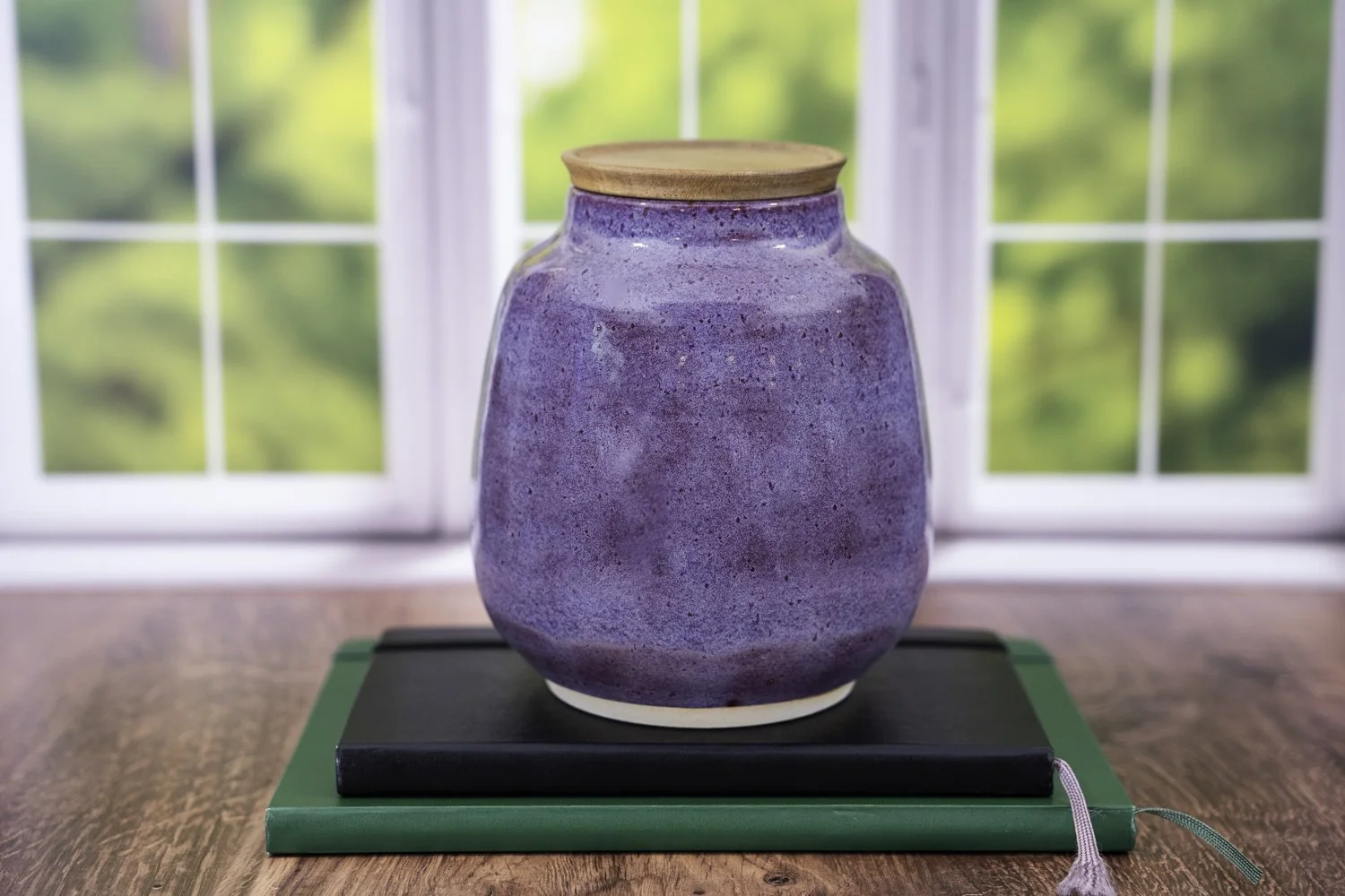Handmade ceramic pet urn with iris purple glaze and solid acacia wood lid, suitable for engraving.