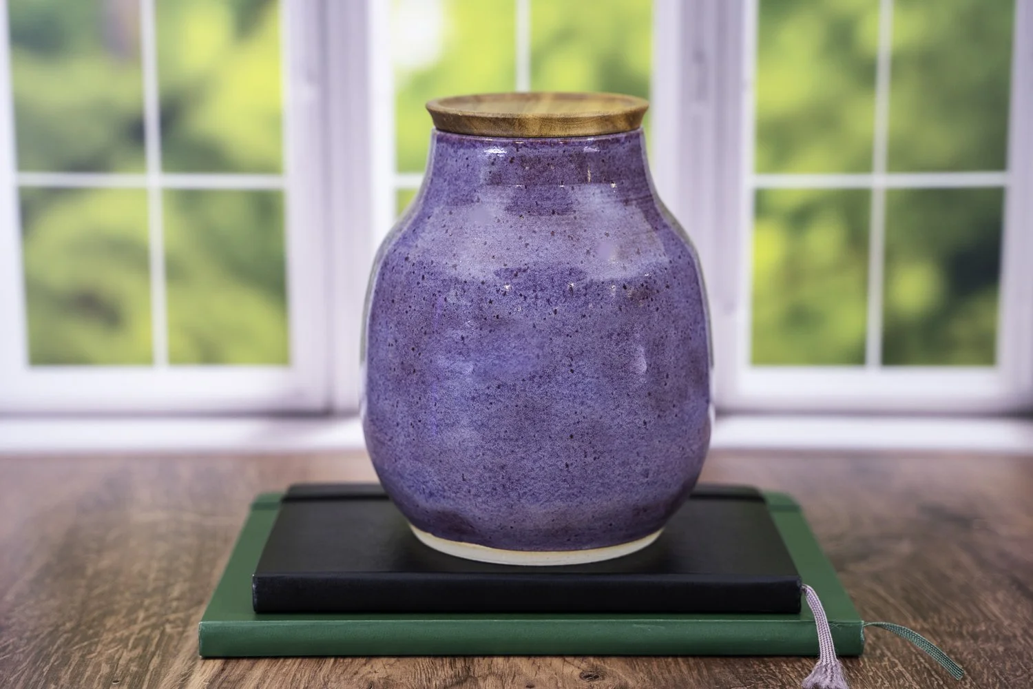 Handmade ceramic pet urn in iris purple glaze with solid acacia wood lid, suitable for engraving.