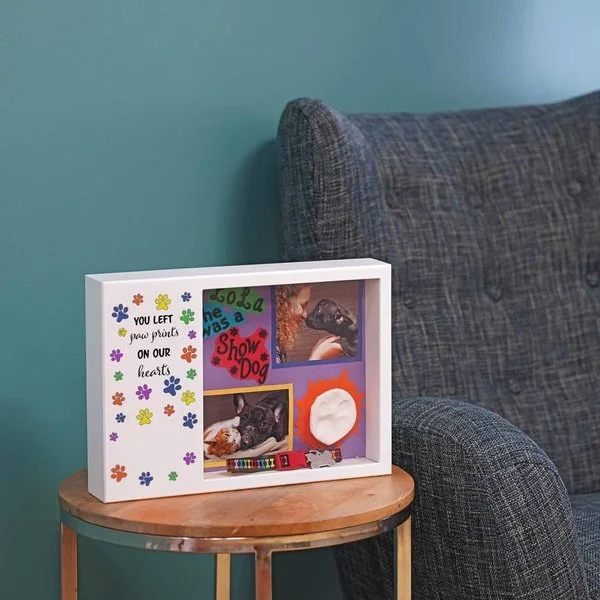 Playful Paws shadow box urn with memento area and lighthearted paw print design for pets.