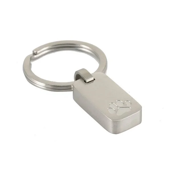 Pewter keychain with paw print design, suitable for personalization and attaching to keys or bags.