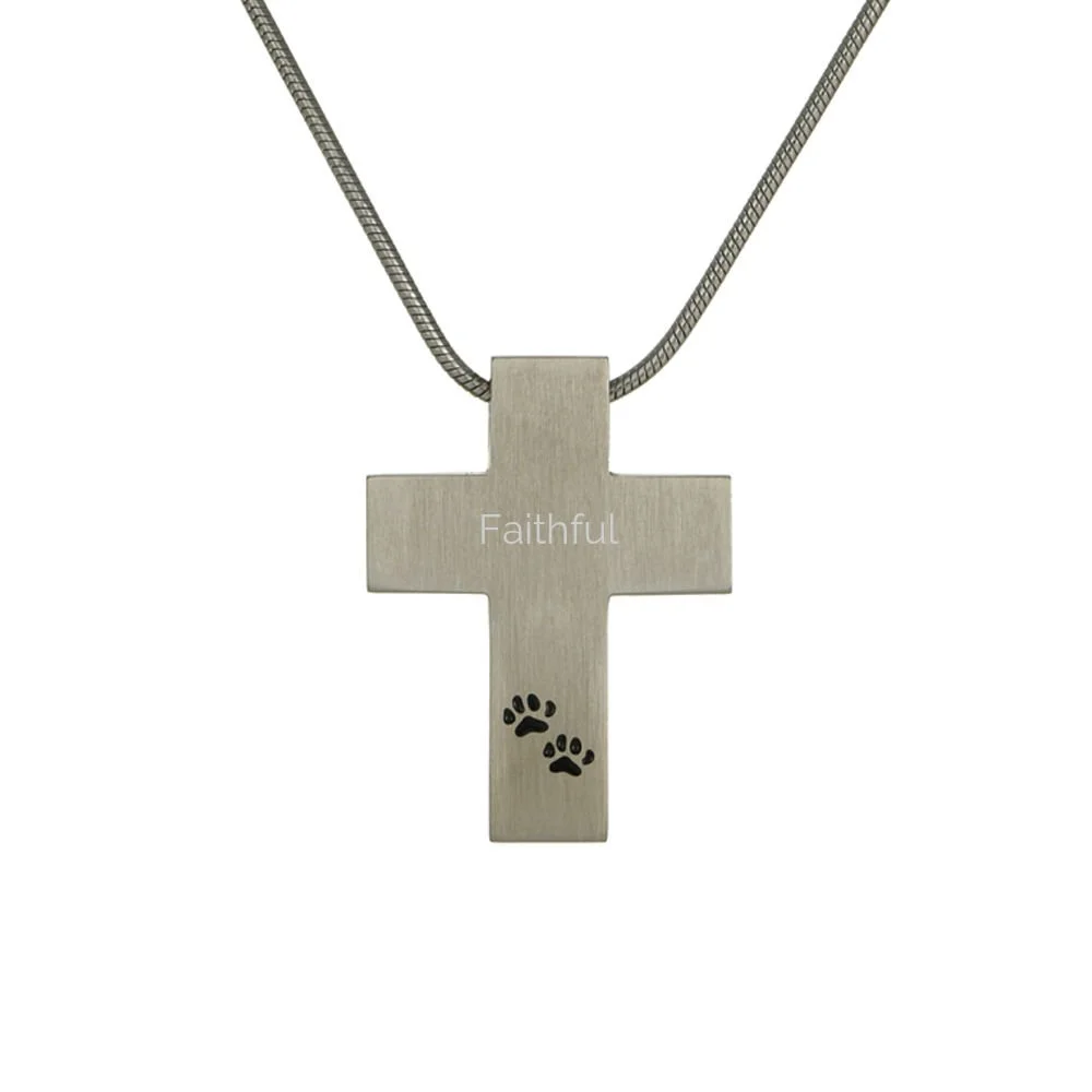 Pewter cross pendant with black paw prints, matching 19-inch chain, and discreet memento compartment.