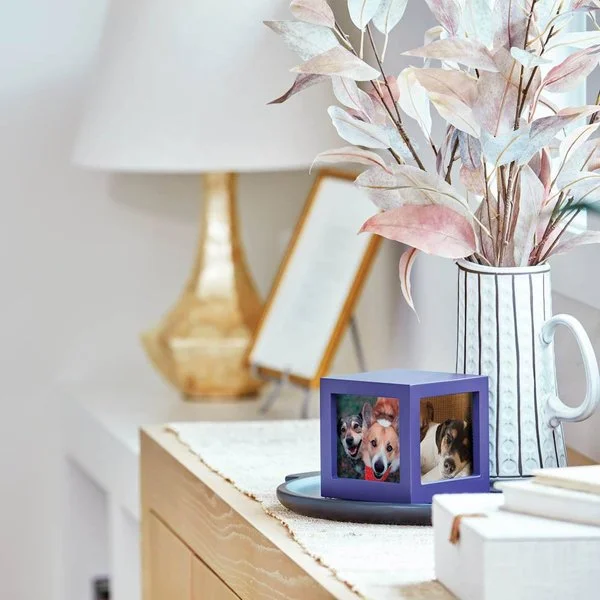 Violet photo cube urn for pets with three photo slots and custom engraving option.