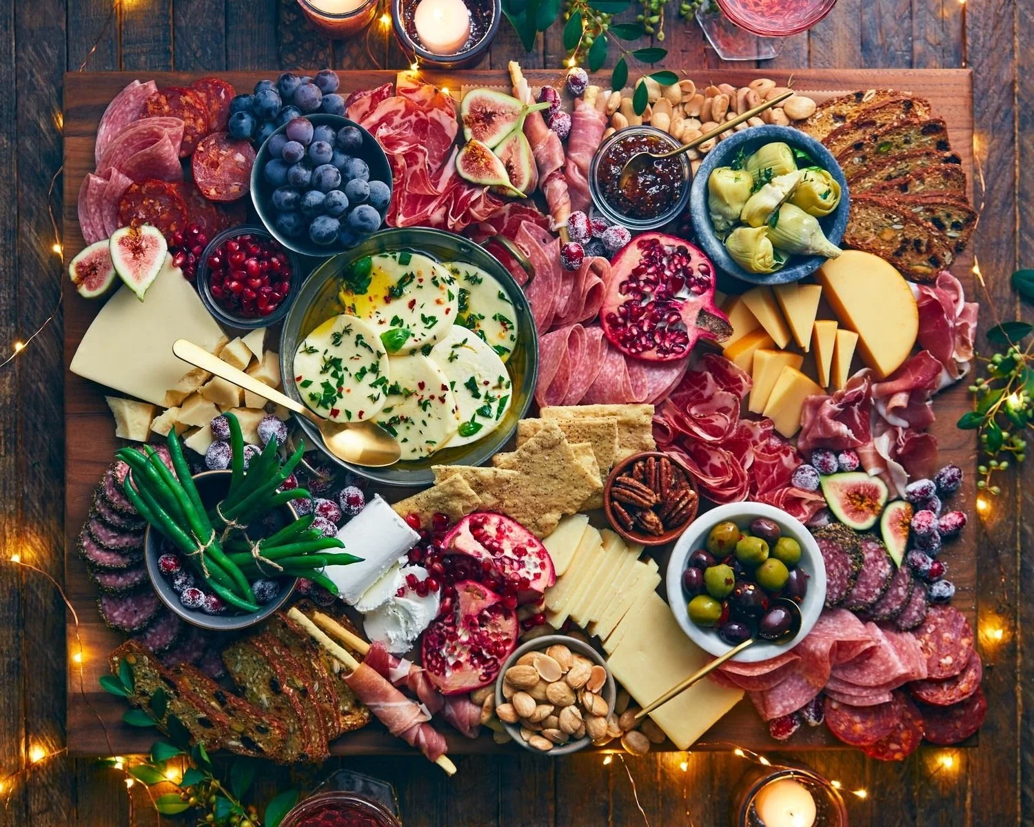 high-end charcuterie board filled with boar's head meats, cheeses, and snacks