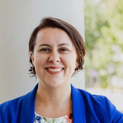 Professional headshot of Mollie Yoder from Alliance Defending Freedom, sharing a testimonial about leadership growth and Working Genius coaching with executive coach Charity Medina.