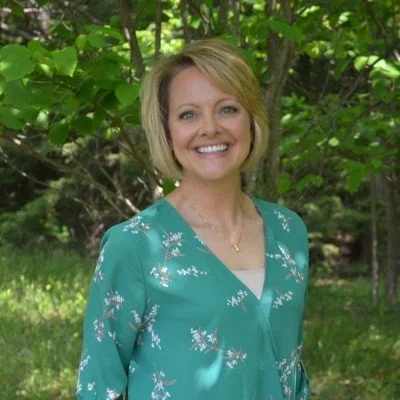 Professional headshot of Jen Rowland from Rowland Leadership, Training & Consulting, sharing a testimonial about strategic clarity and executive coaching with Charity Medina.