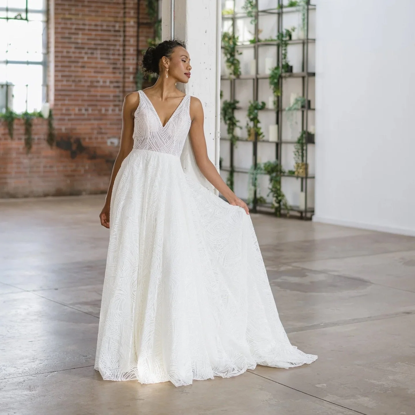 Graceful from every angle. 

Olympia by Lis Simon is the definition of modern romance.
With her lace overlay, illusion V-neckline, ultra-low illusion back, and full A-line skirt that flows into a soft court train, she&rsquo;s made for the bride who w