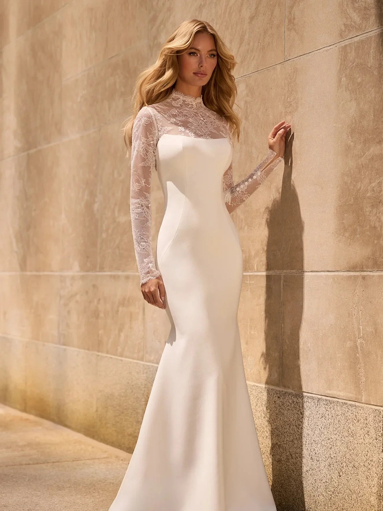 Brand new arrival, and she&rsquo;s all about the sleeves. 🤍

This cr&ecirc;pe modified princess cut gown by Mikaella is elevated by exquisite Chantilly lace sleeves that steal the spotlight. From the illusion scalloped jewel neckline to the lace bac