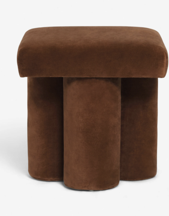 A velvet foot stool. 