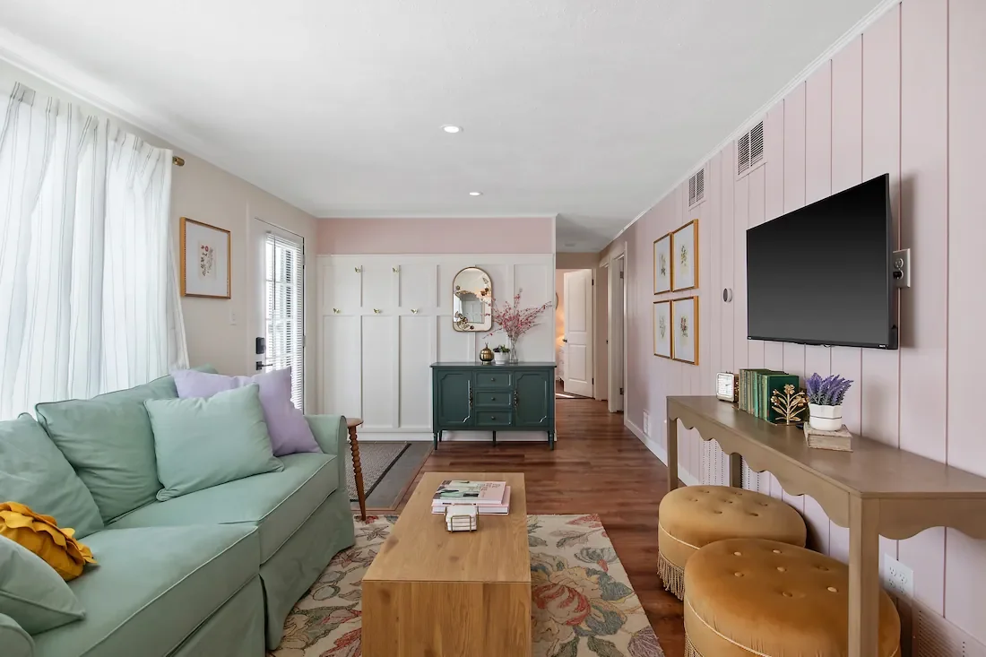 Wildflower Cottage short-term rental design living room, entrance, and hallway view