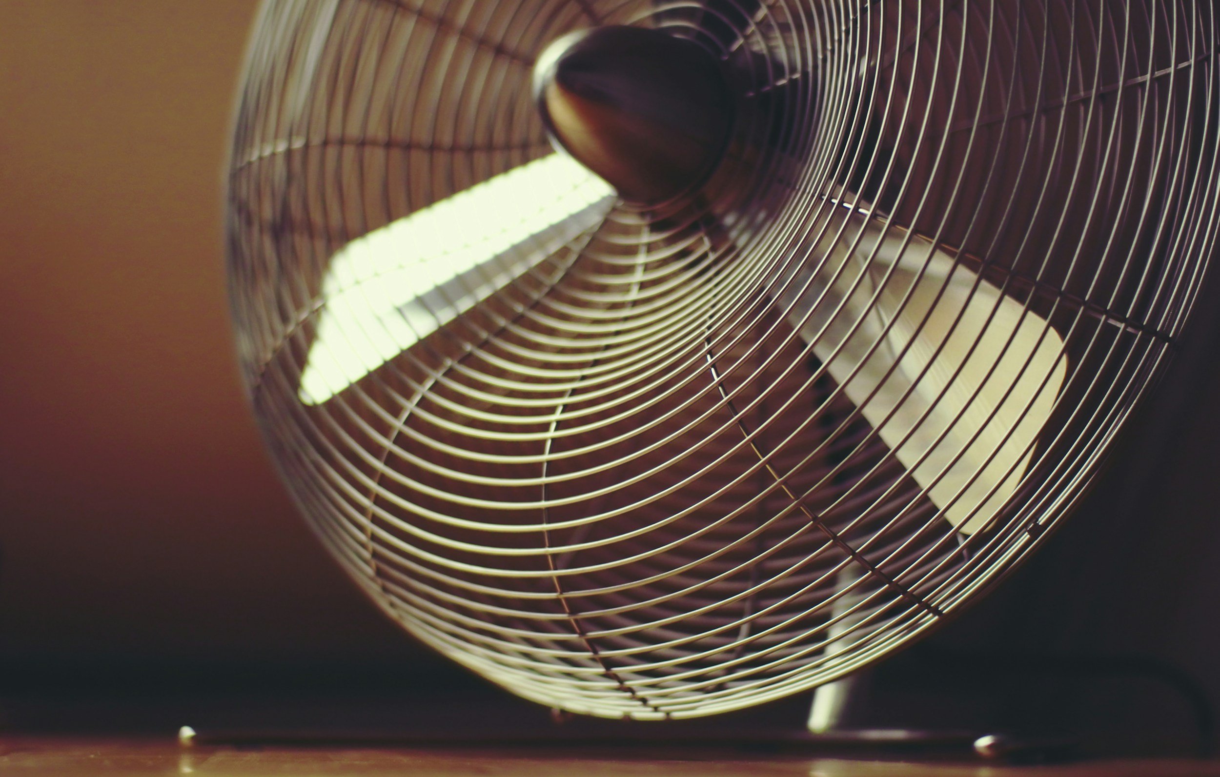 Arranging fans to ventilate your home and lower temperatures