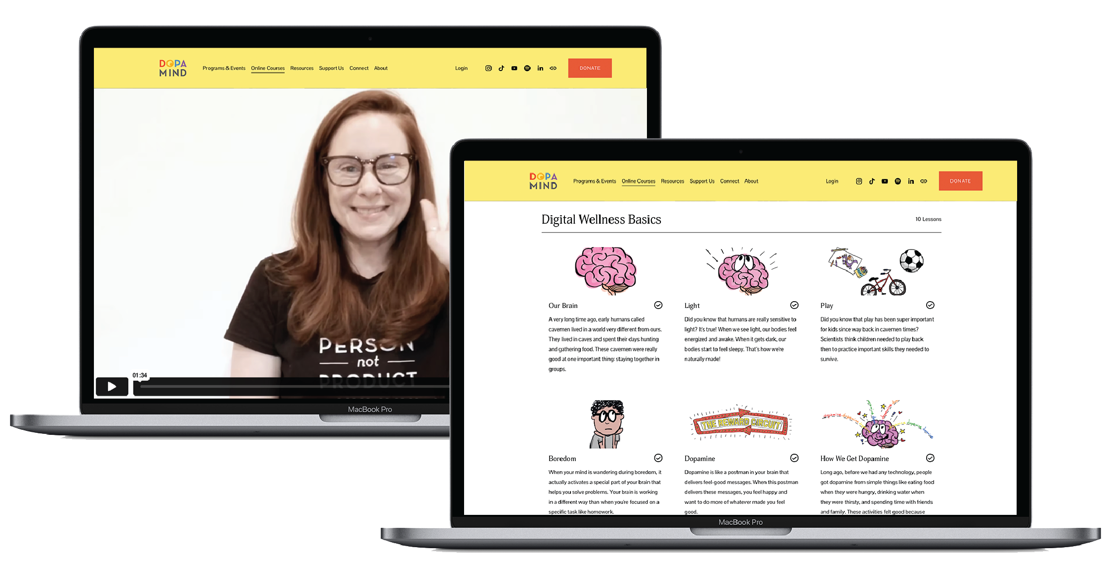 Two MacBook Pro laptops displaying a website related to mental health education. The left laptop shows a woman with red hair and glasses smiling, with a video player in the bottom left corner. The right laptop shows a webpage titled "Digital Wellness Basics" with illustrations of brains and various mental health topics.