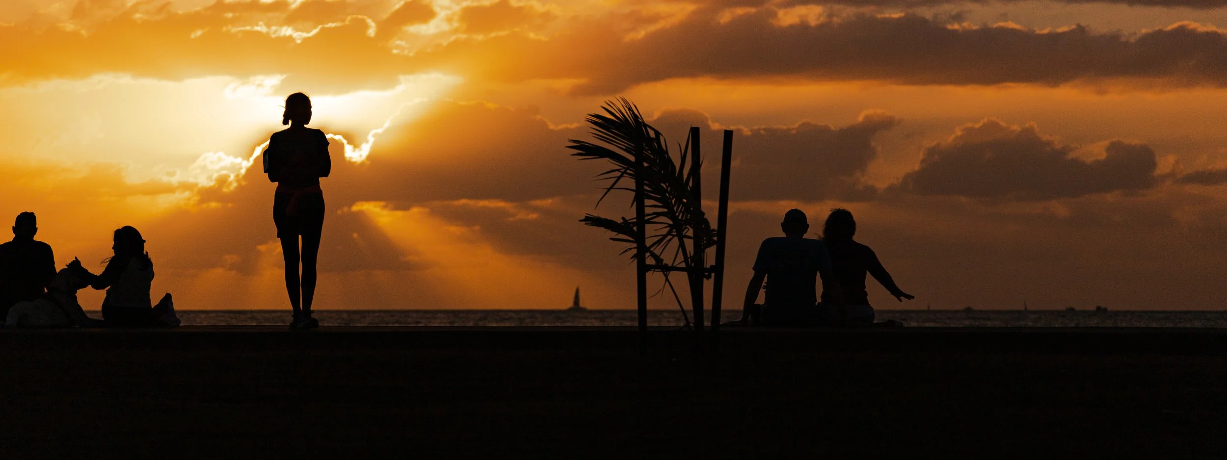 Woman and two couples taking in the sunset-2.jpg