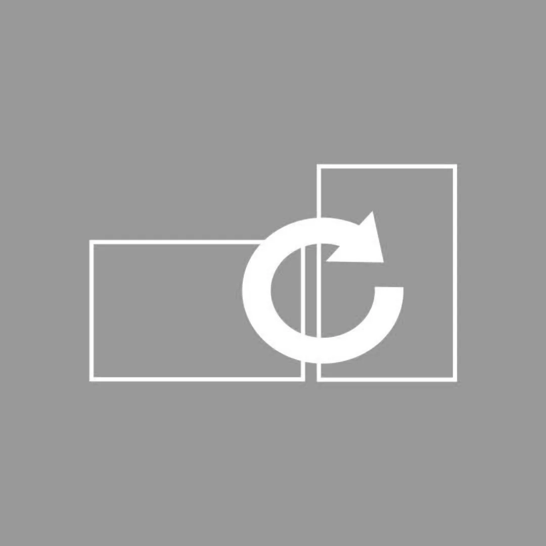 A white recycling symbol with two arrows forming a circle, placed in front of overlapping rectangles on a gray background.