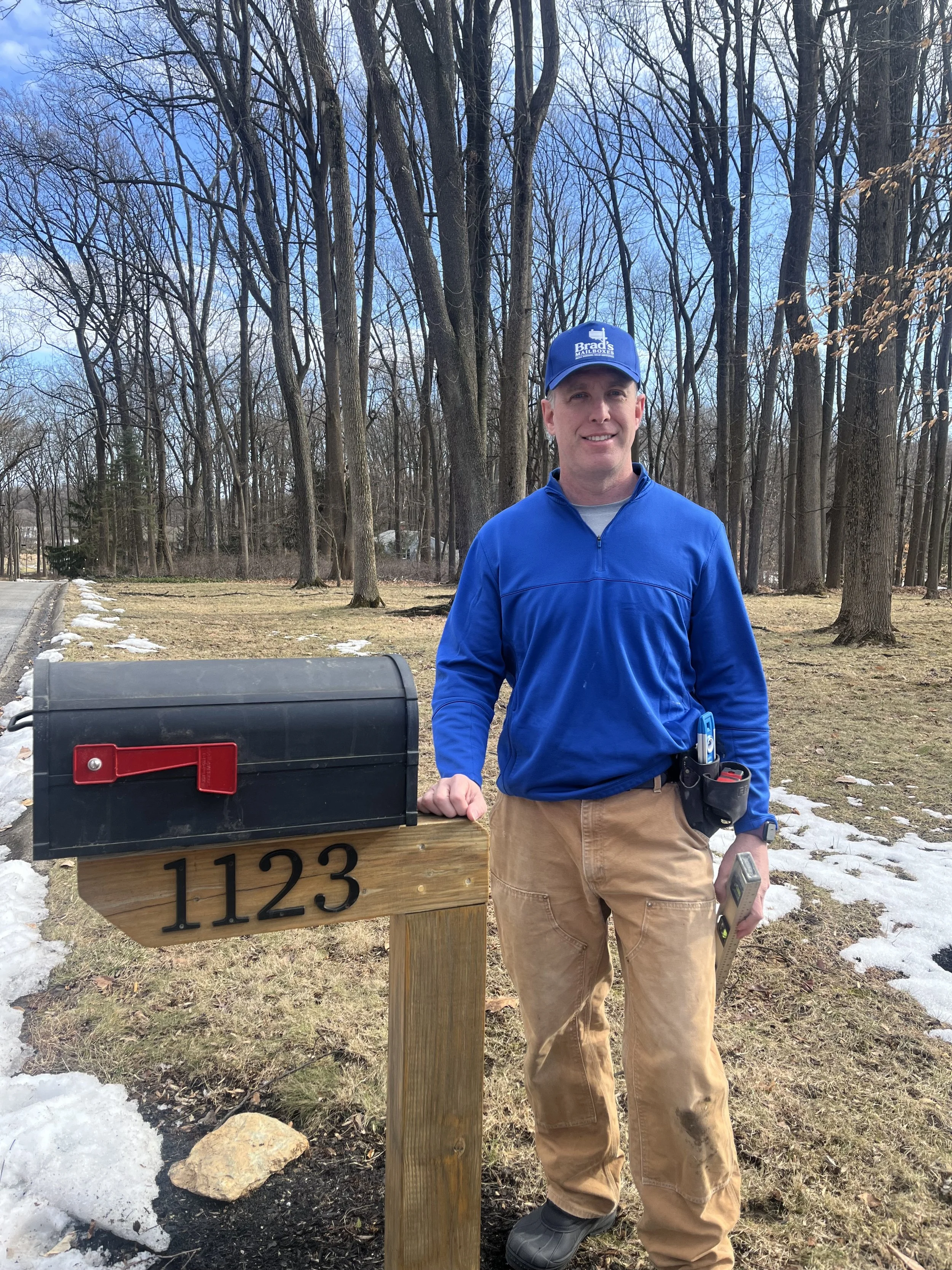Brad standing beside a newly installed mailbox