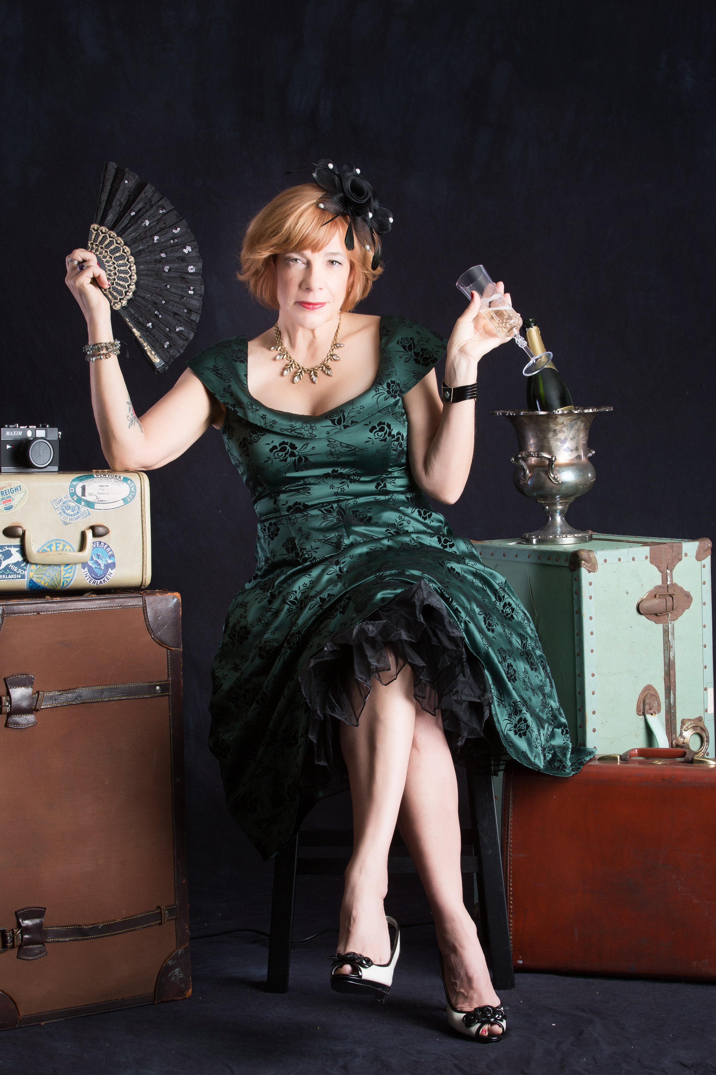 Promotional Headshots marketing and branding photoshoot redheaded woman in green lace dress with fan and cocktails performance 