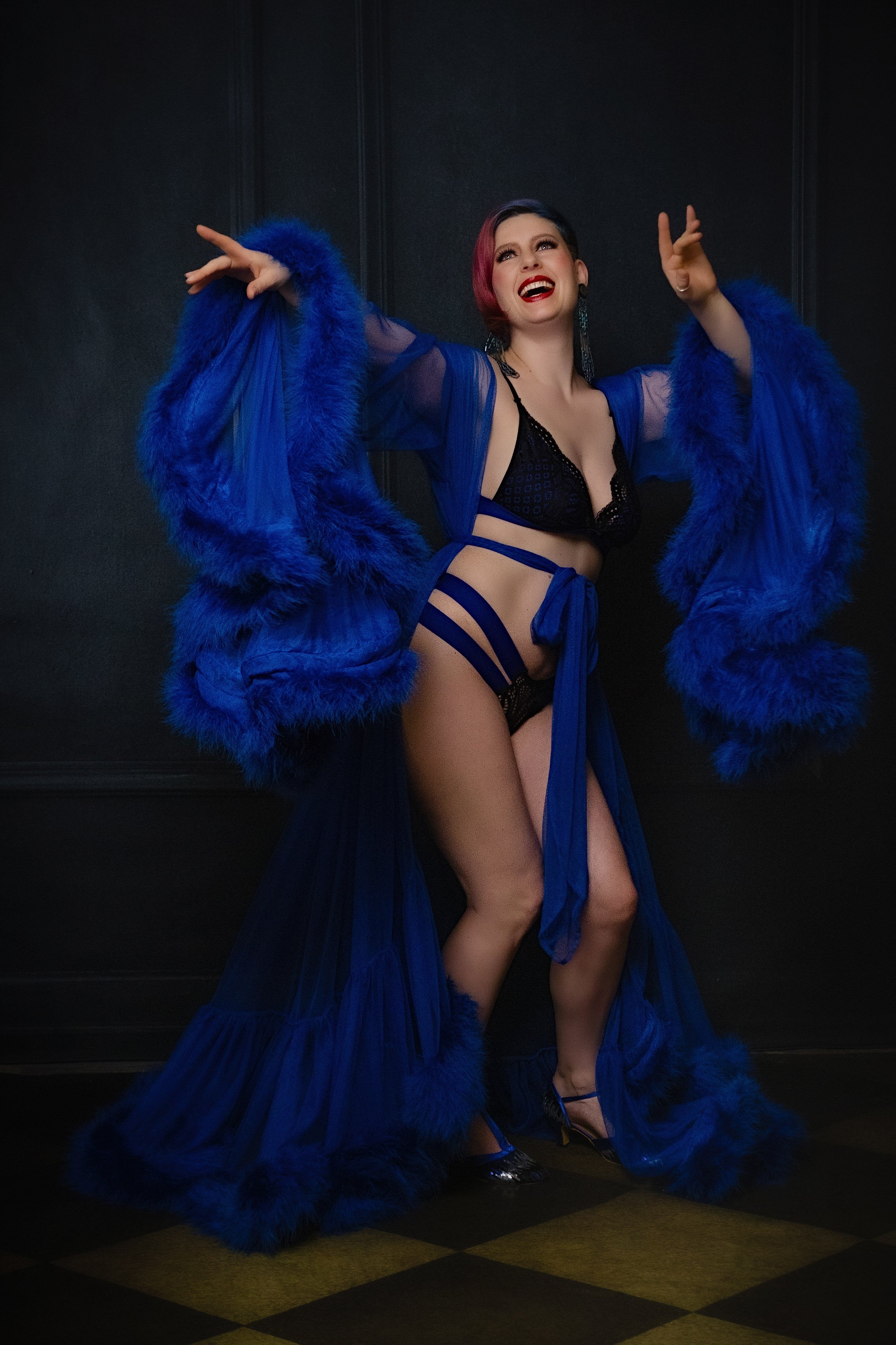 Fun Boudoir Image Woman in bold blue and black lingerie Boudoir Photoshoot Grass Valley Kim Sayre Portraits