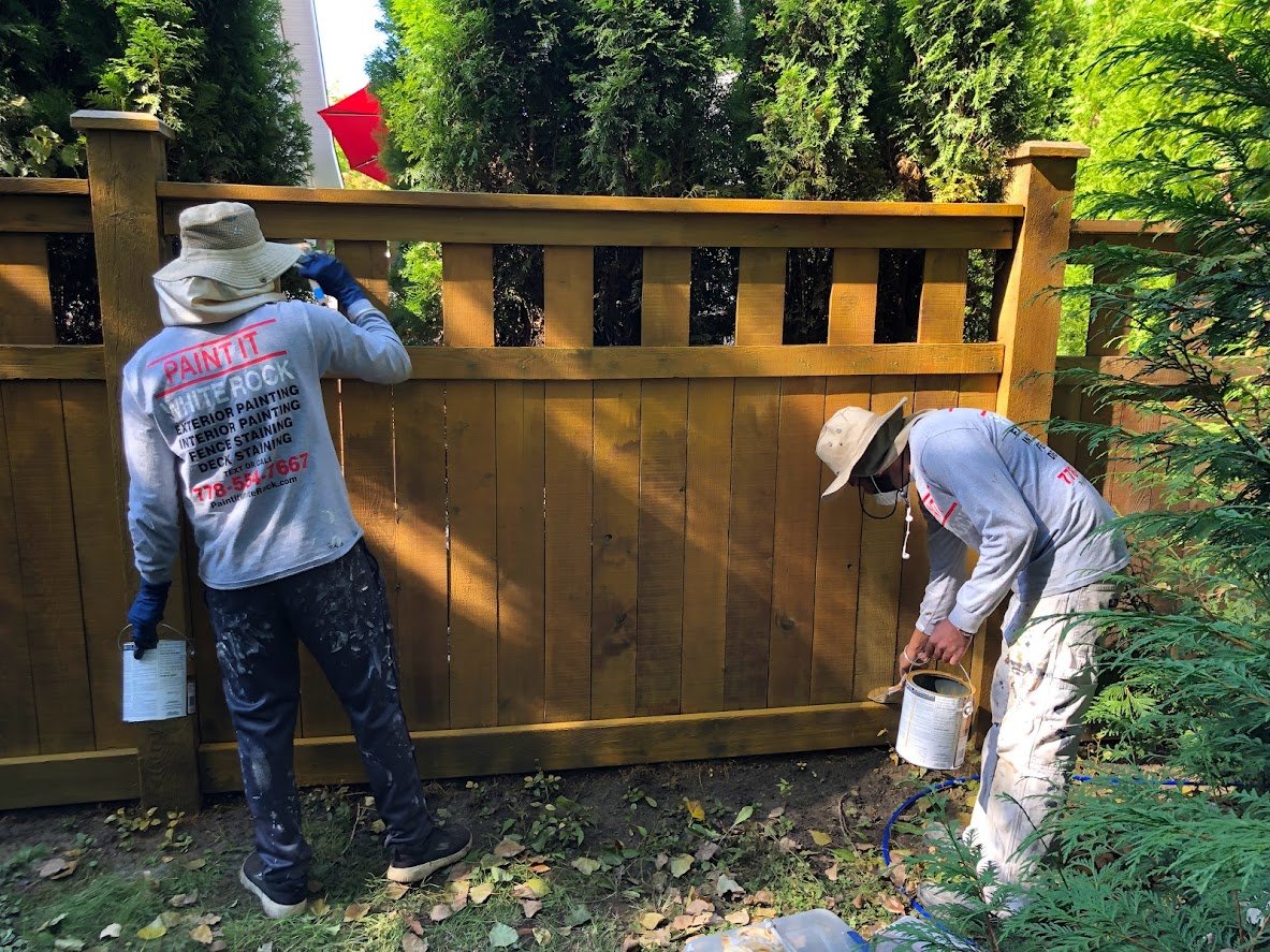 After pressure washing, spraying on the stain and then back brushing!