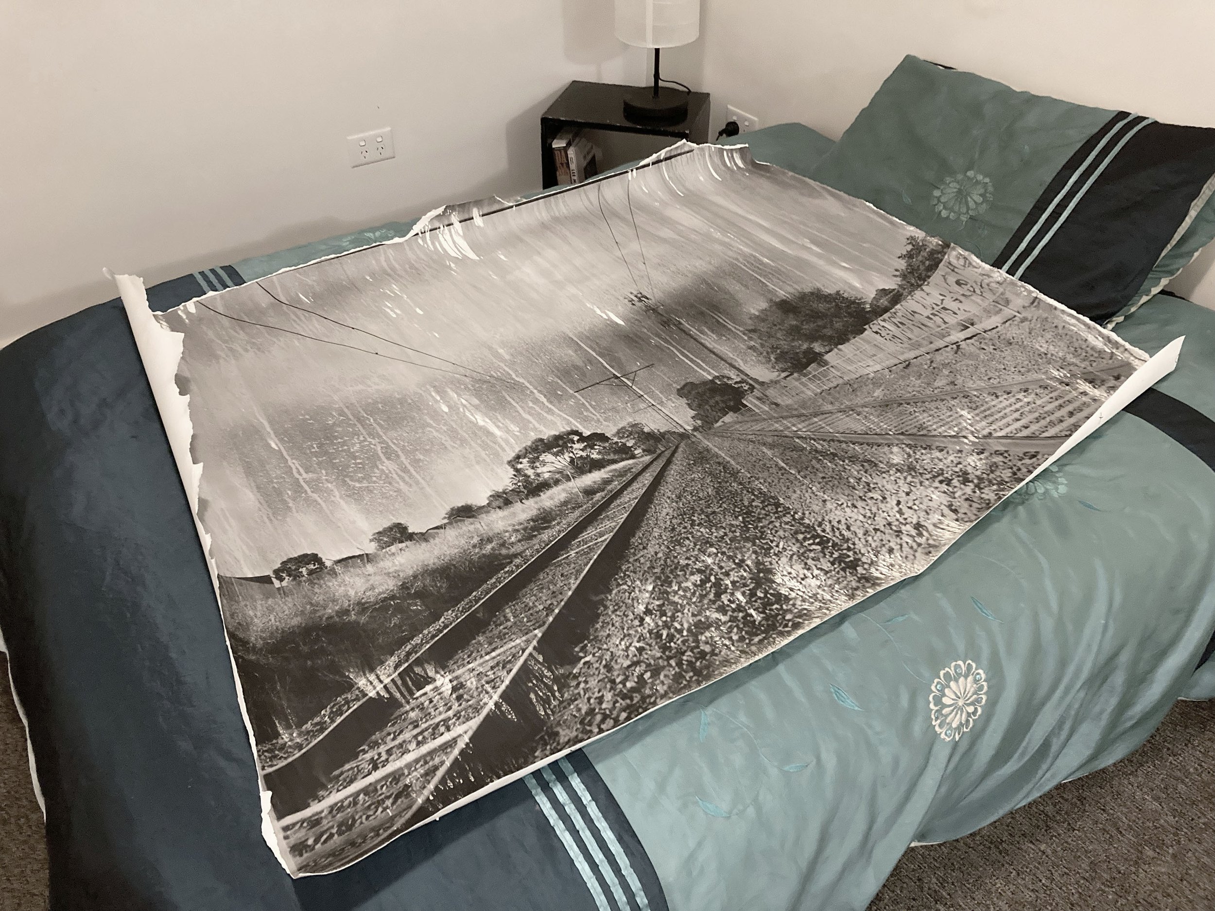 Zo Damage 2022-23, “NYD”, 1.5x1.25M gelatin silver print. The queen-sized bed emphasises the scale of the print. Compared to some of my other work, I thought this one would be relatively easy. It wasn't. 