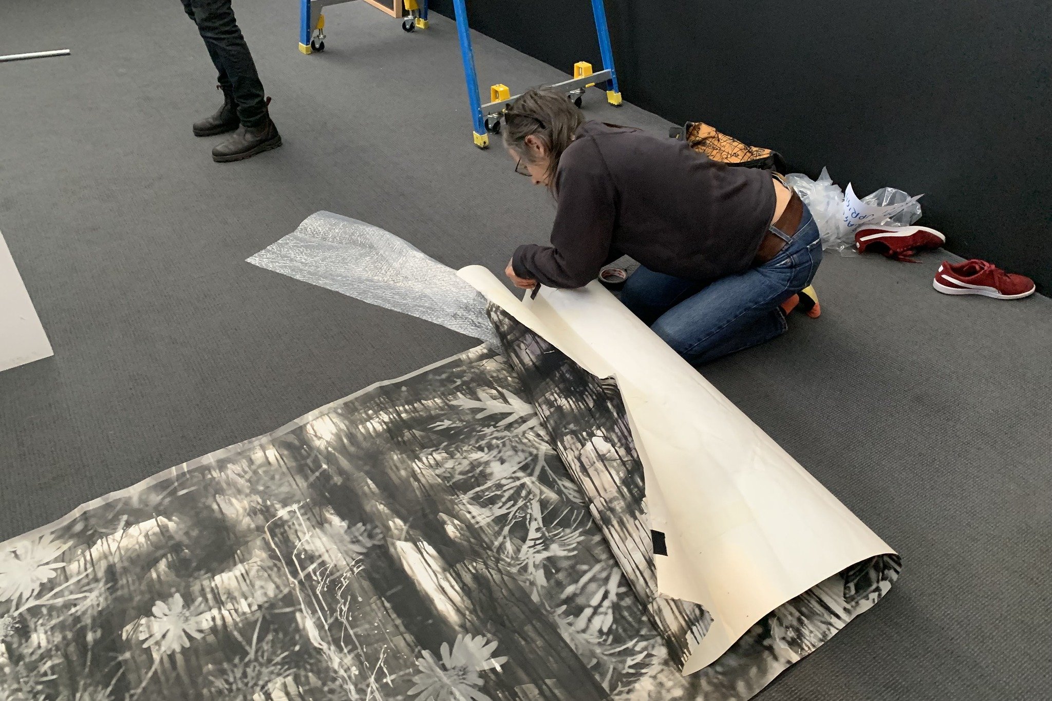 Zo Damage installing "TRUST" (2022) – MAPh Bowness Photography Prize 2023 shortlist – for the MAPh Bowness Prize 2023 finalist group exhibition. Photo courtesy MAPh, 2023 
