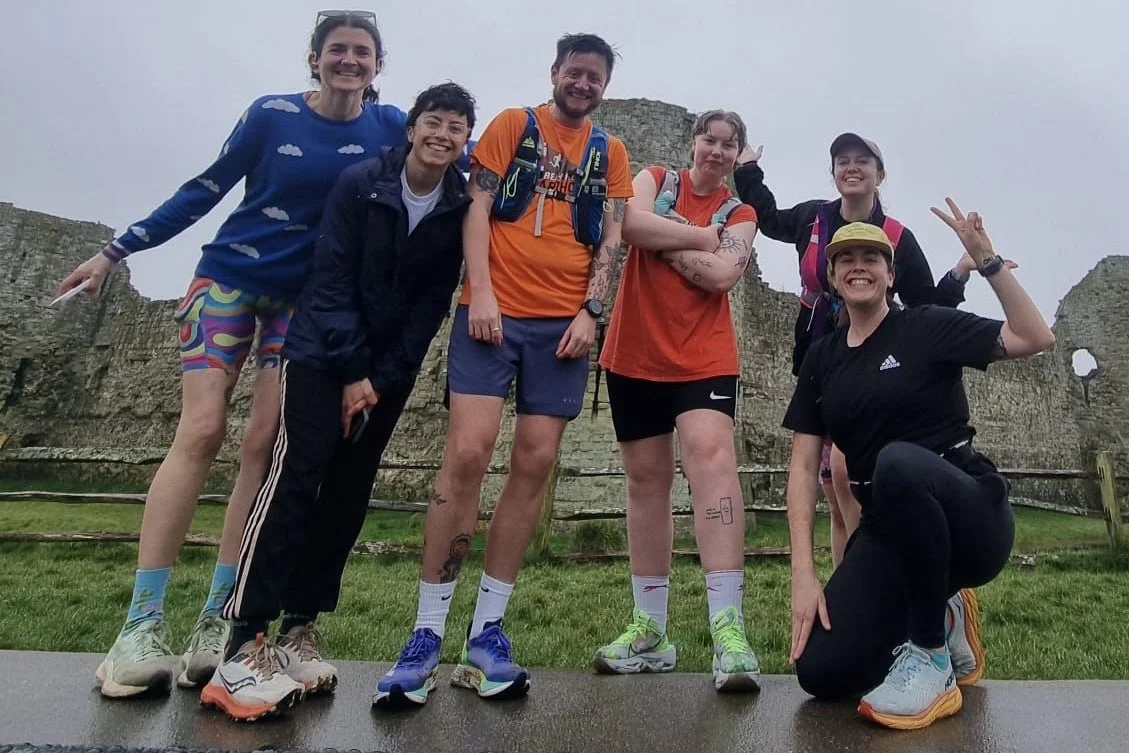 six people in sportswear smiling