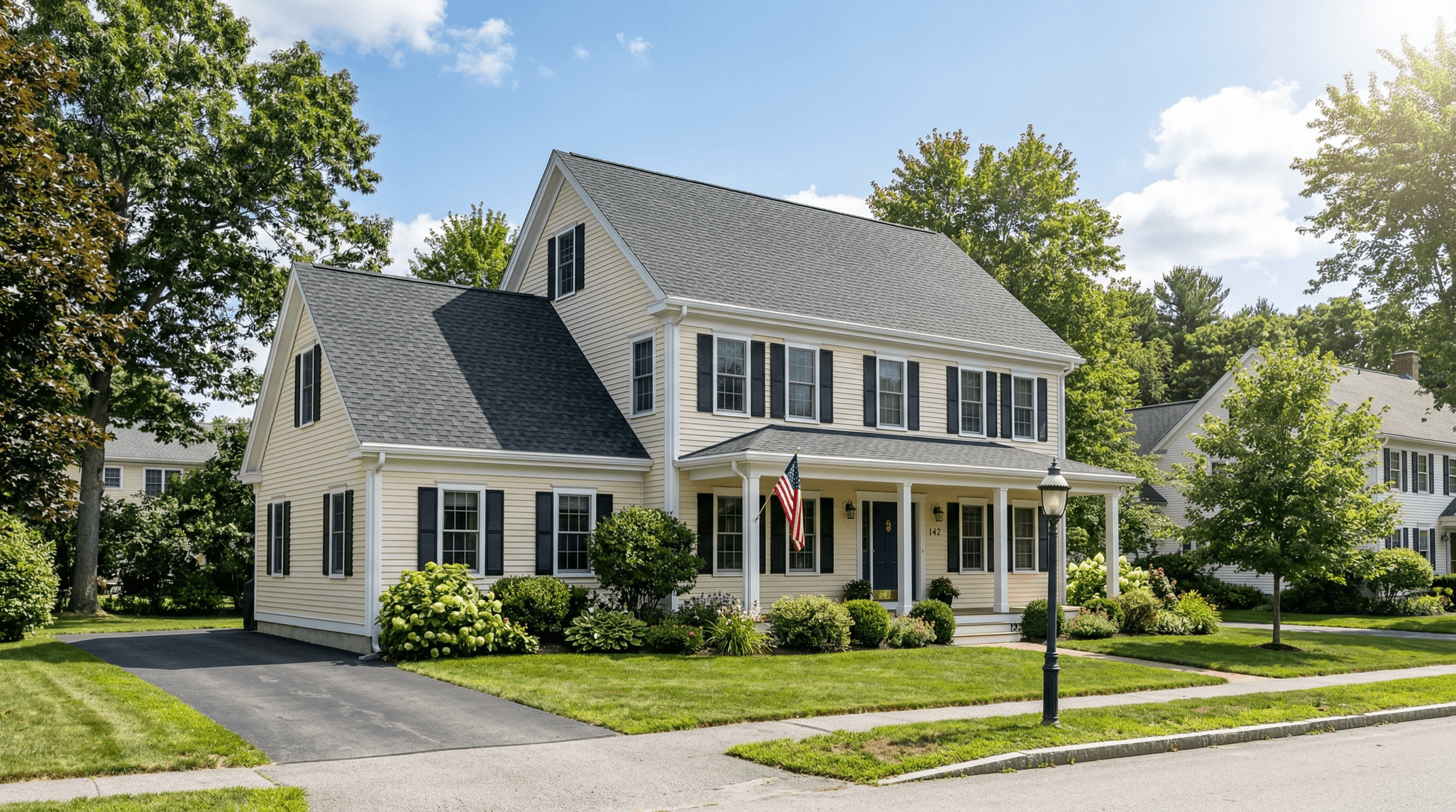 New architectural shingle roof being installed on a Maine cape-style home