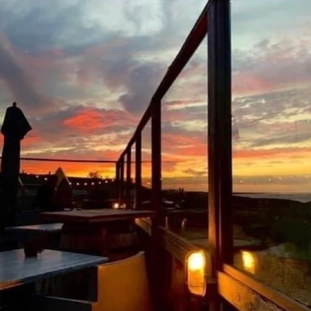 Zonsondergang vanaf het terras van Paviljoen 't Schor in Paal