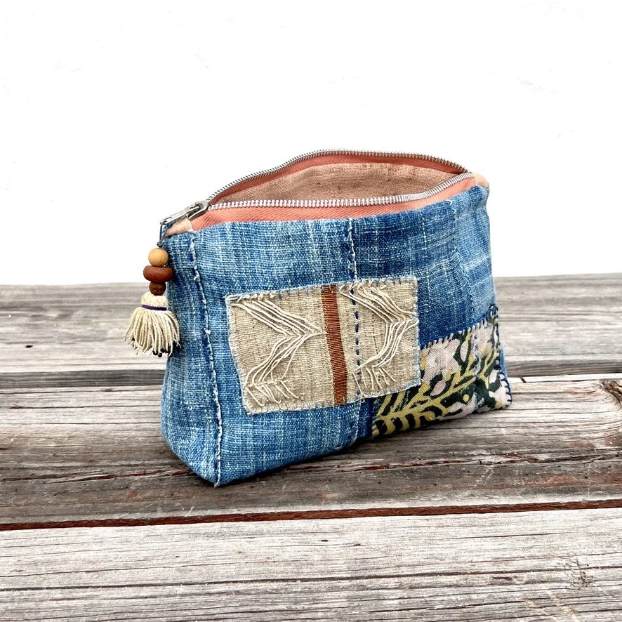 Indigo cloth pouch with patches zipper open
