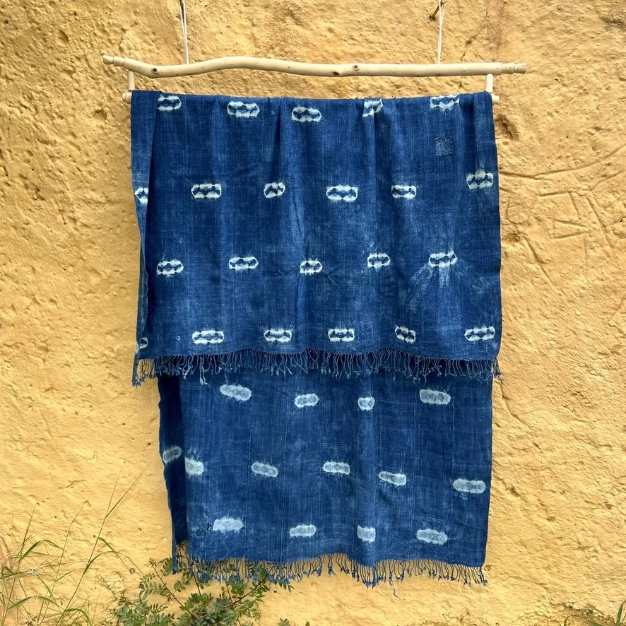 large indigo textile resist-dye with fringe yellow background