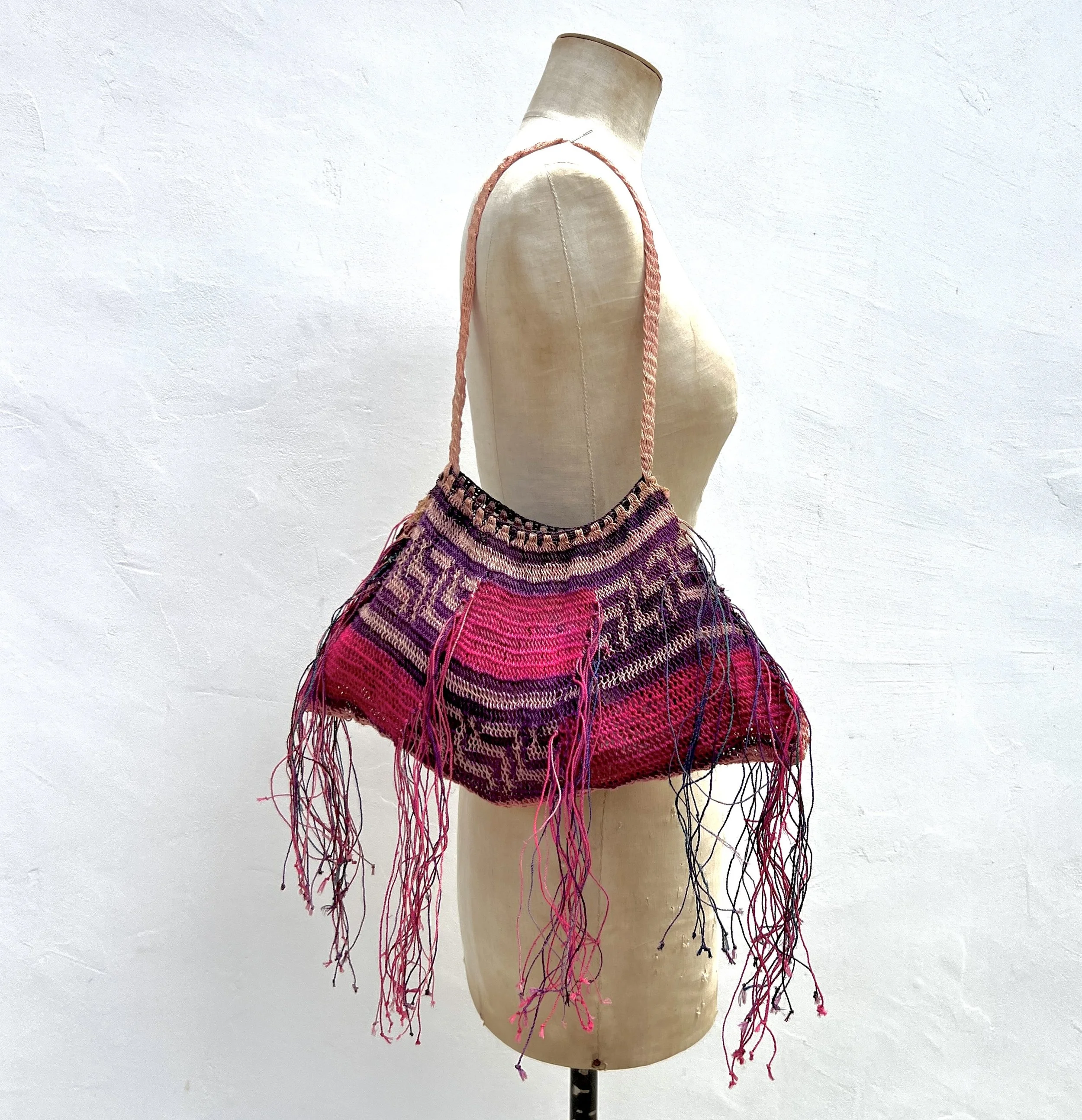 Pink Madang Bilum bag with fringe on model