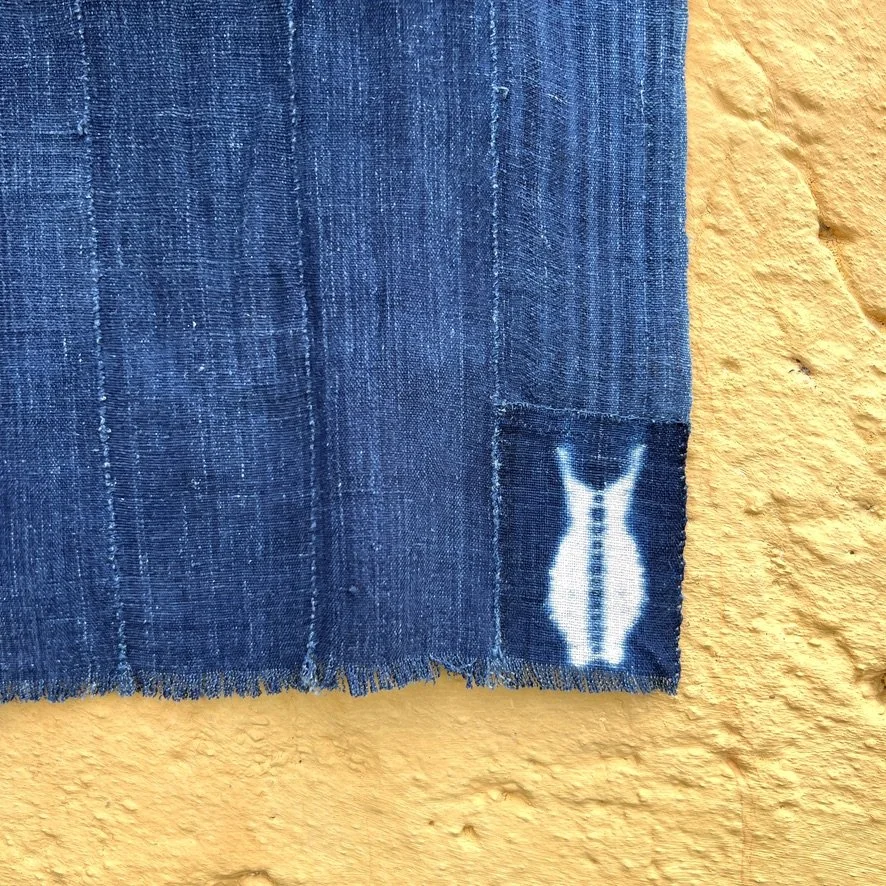 indigo cloth fish patch visibly mended closeup 1