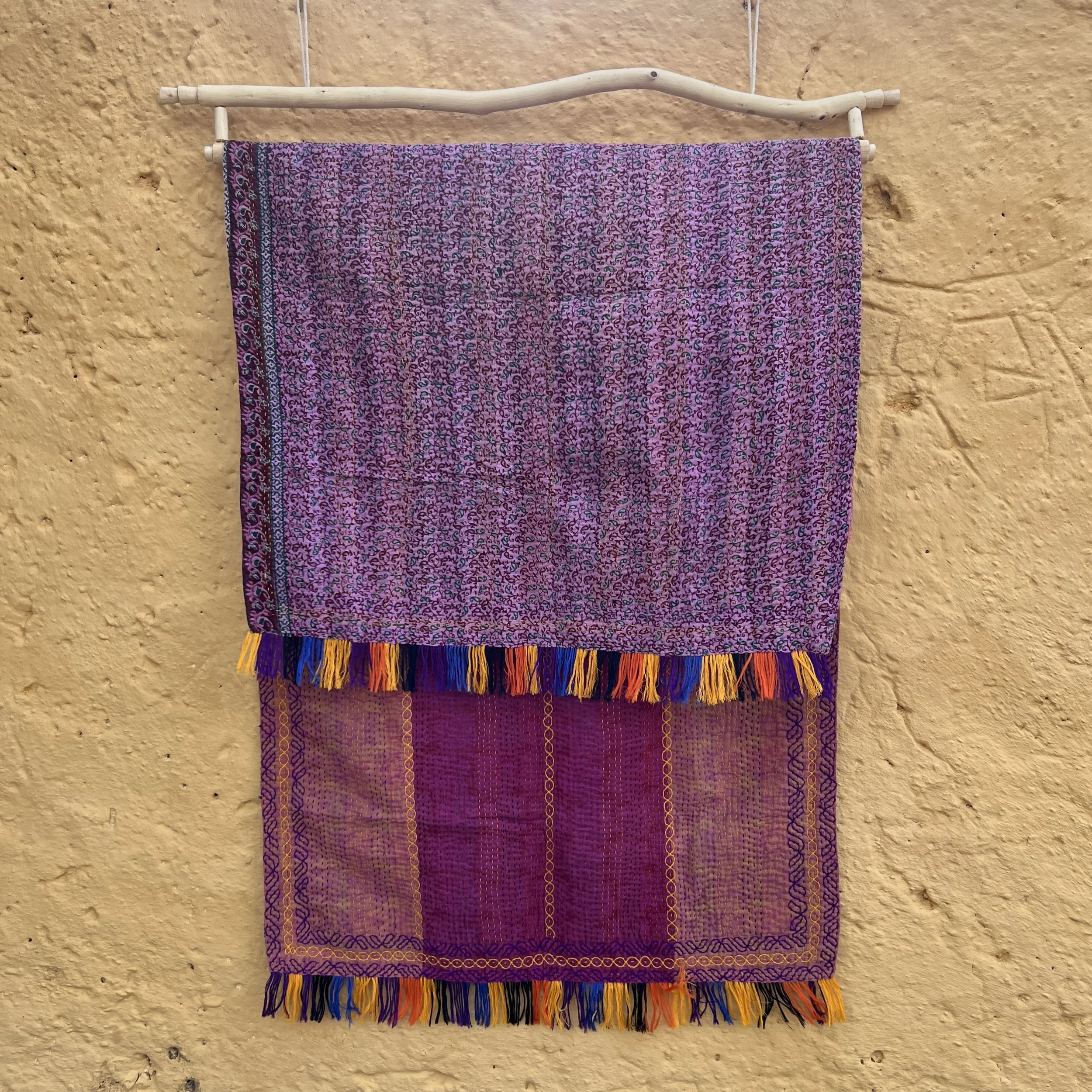 Kantha shawl Bangladesh pink reverse side on yellow wall