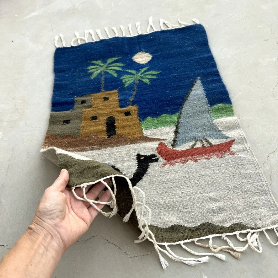 Egyptian wall tapestry with camel with hand