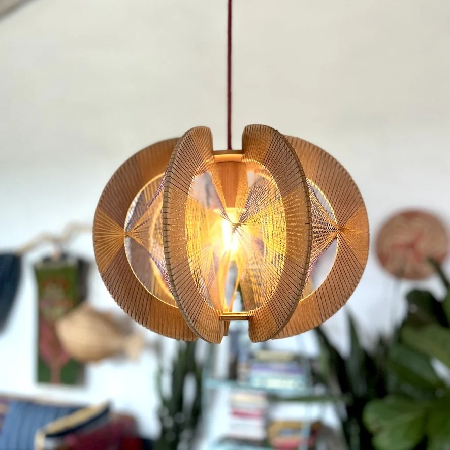 plywood string pendant lamp hanging with light on