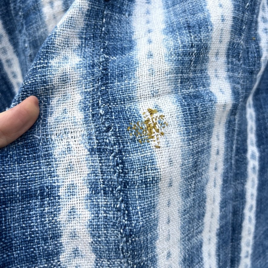 Vintage indigo scarf resist dye mustard thread closeup 2