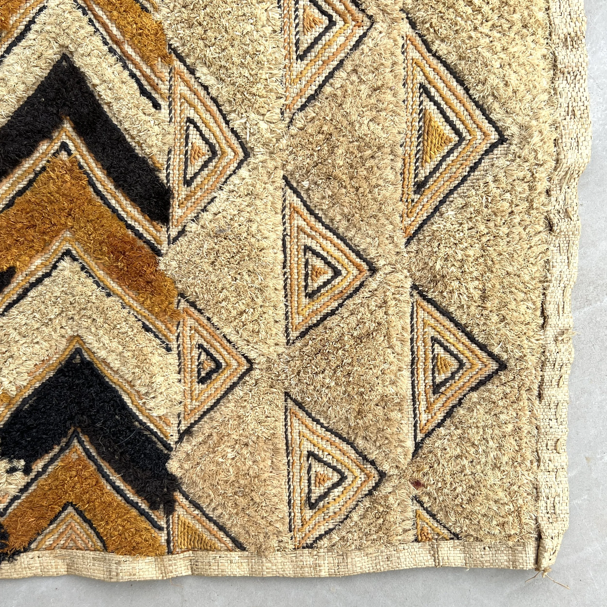 Kuba cloth pile triangles closeup triangles