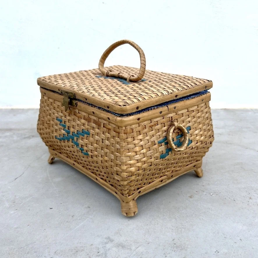 small vintage rattan sewing basket with sewing accessories side