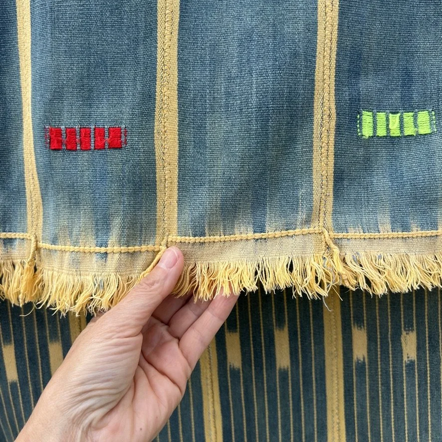 Baoulé blanket petrol yellow closeup fringe