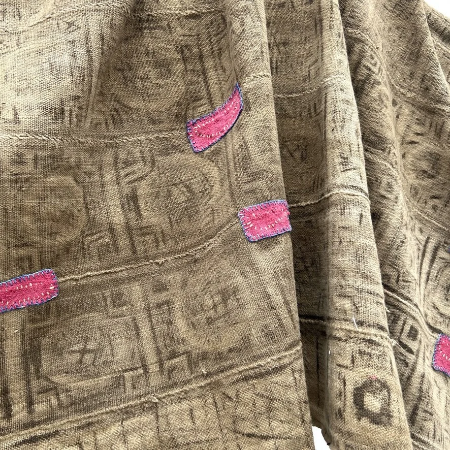 Visibly mended Mali mud cloth patches back