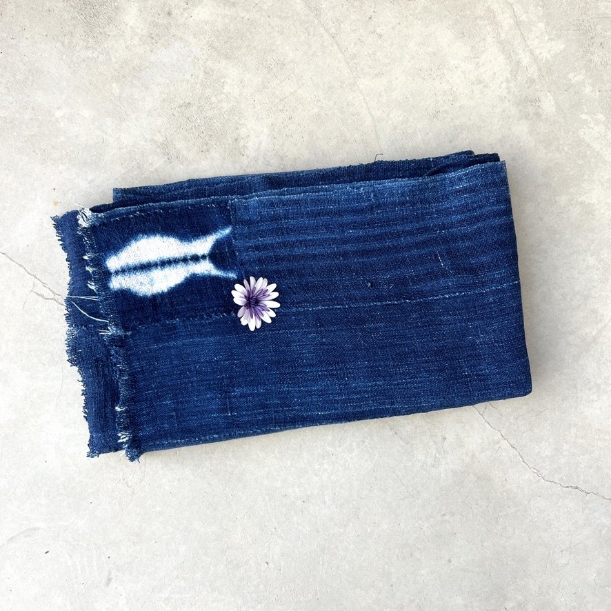 indigo cloth fish patch visibly mended folded