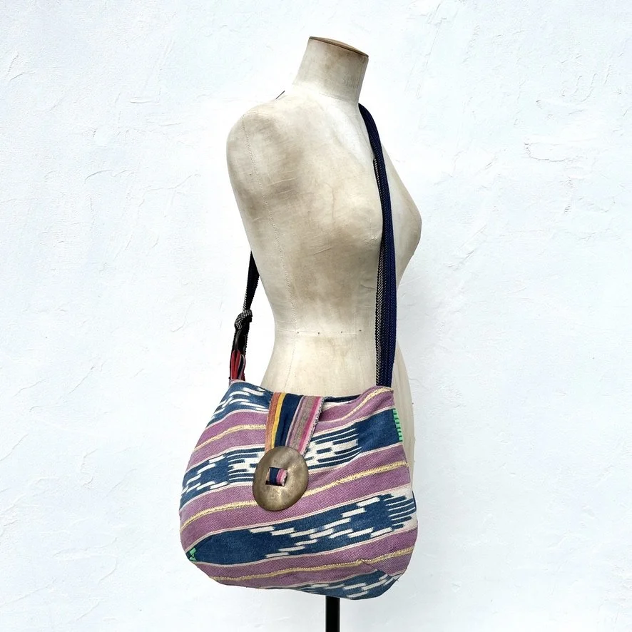 Reversible cross-body bag ethnic textiles on model