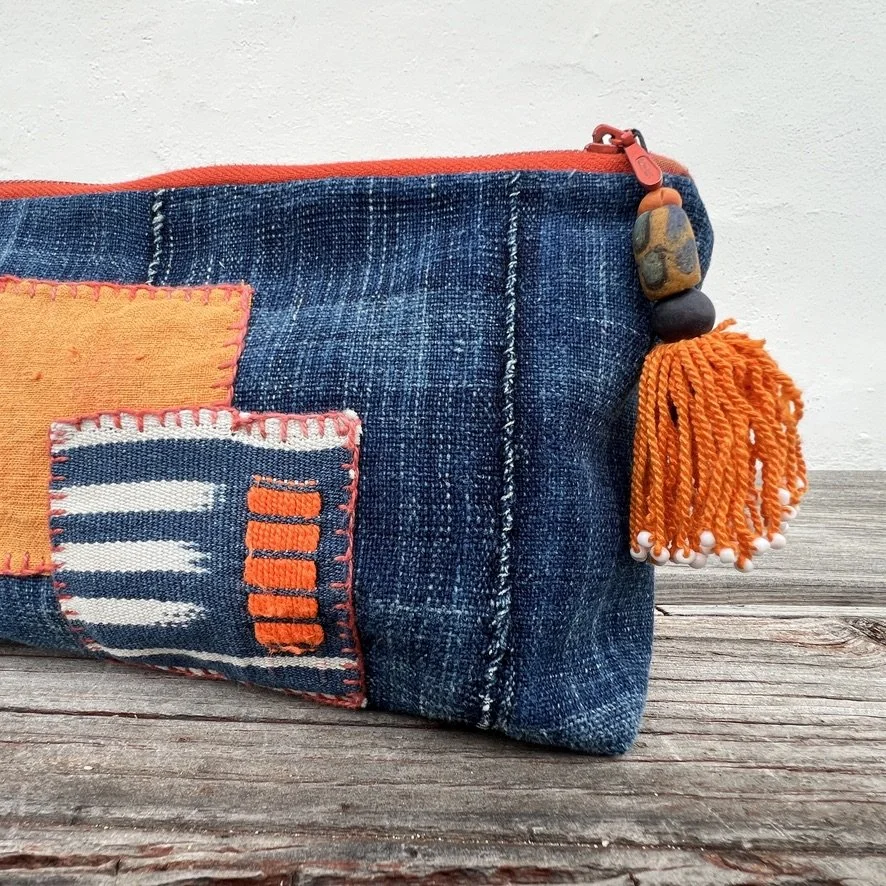 Indigo cloth pouch with orange patches closeup